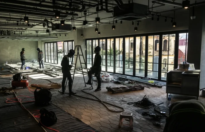 bar cafe build outs construction industry workers working inside moder