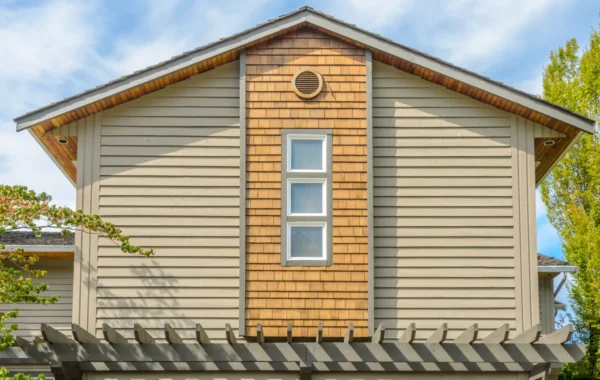 clapboard siding the top of the house with nice window