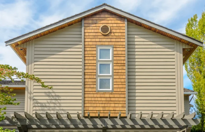 clapboard siding the top of the house with nice window