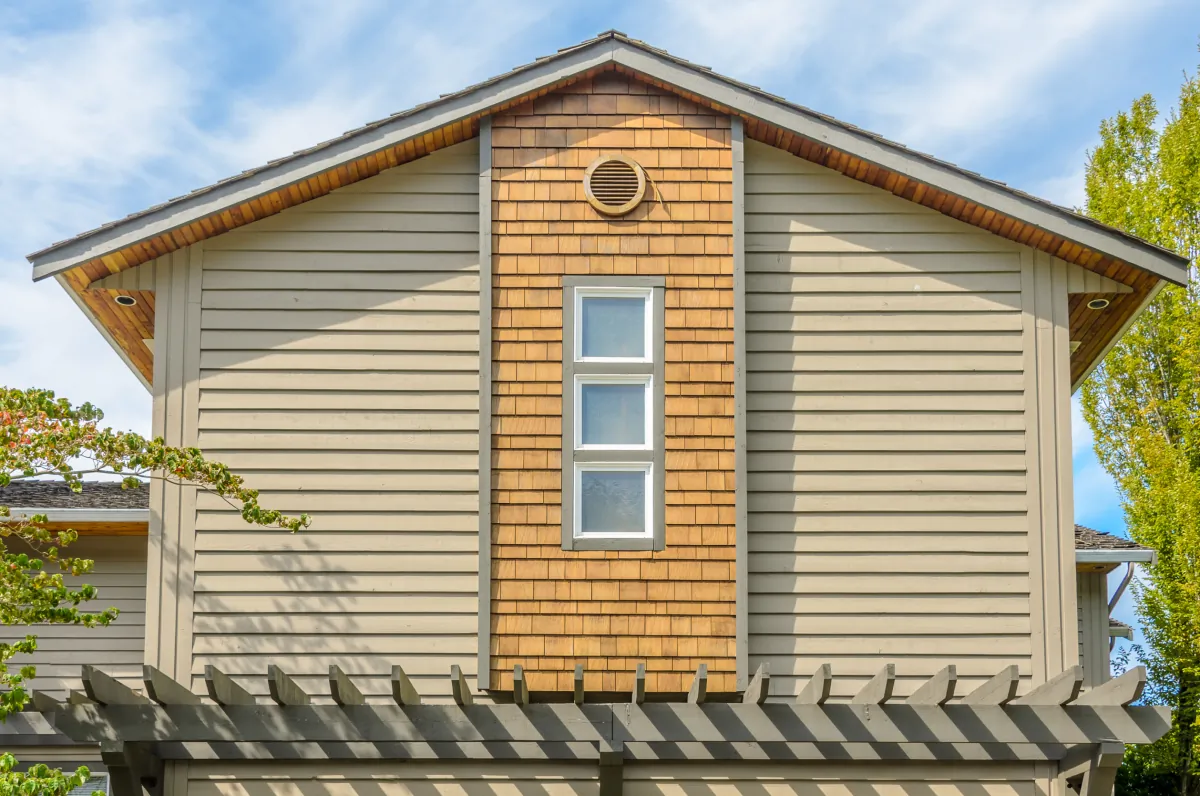 clapboard siding the top of the house with nice window