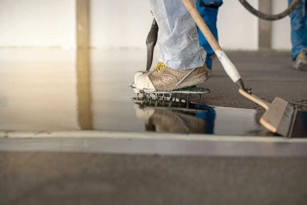 clean jobsite home protection worker working on the floor of an industrial