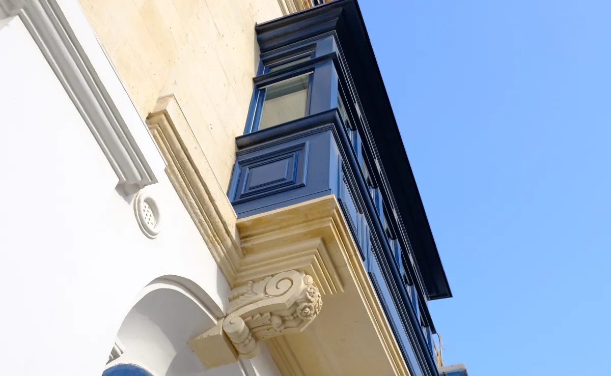 exterior window trim bottom up view of the blue wooden balcony with