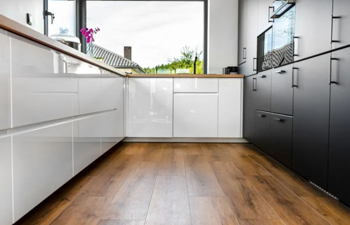 kitchen flooring a modern kitchen with white and black fronts and a