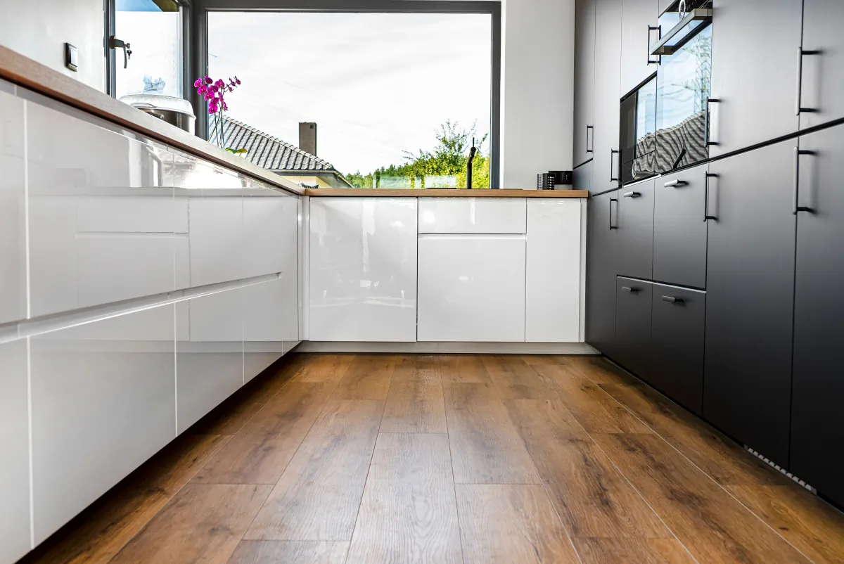 kitchen flooring a modern kitchen with white and black fronts and a