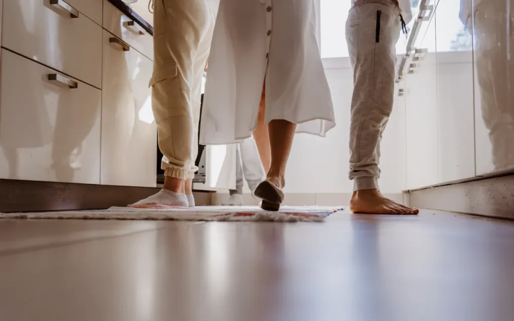 kitchen flooring family cooking together at home unusual angle of