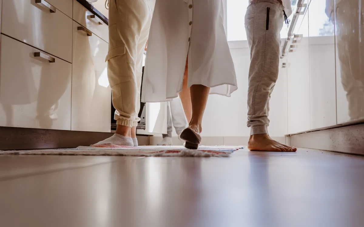 kitchen flooring family cooking together at home unusual angle of