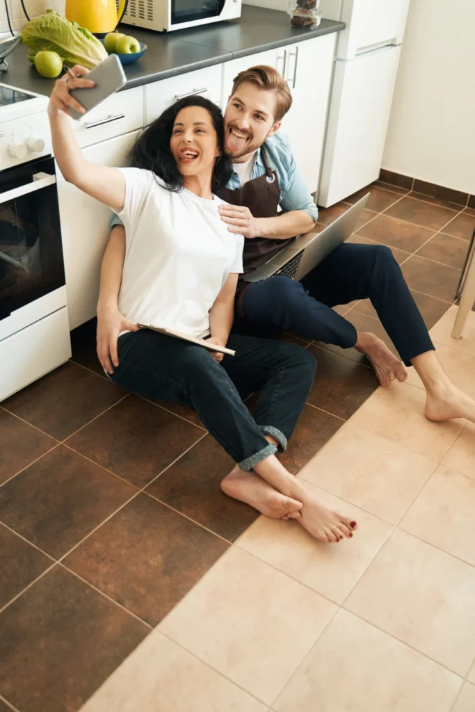 kitchen flooring funny young couple taking photos with smartphone