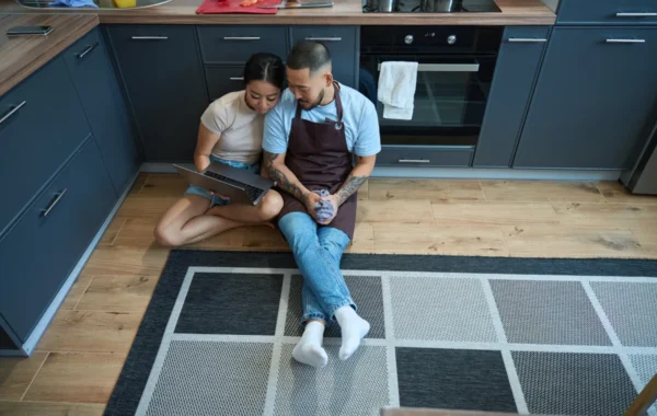 kitchen flooring man woman sit kitchen choose recipe