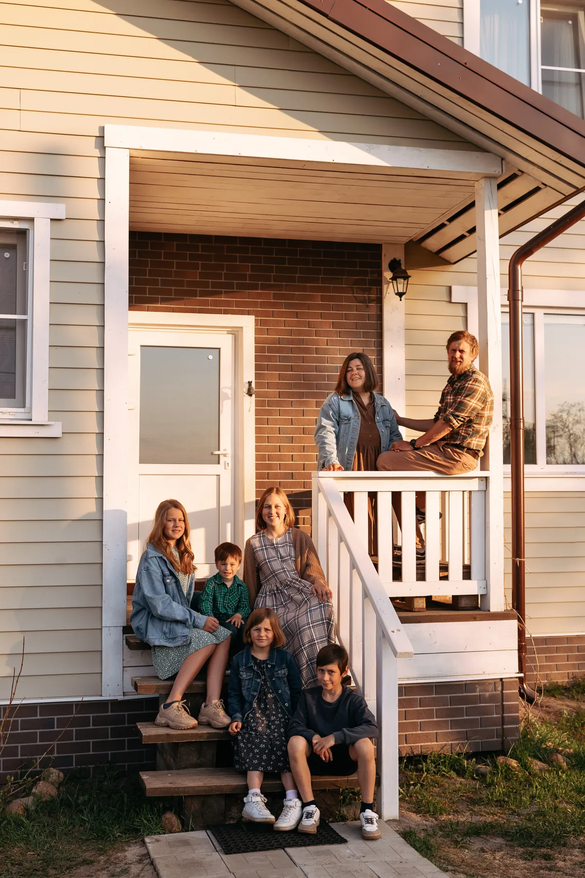 siding happy big family on the porch of the ranch style h