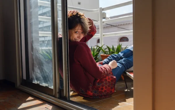 sliding window woman her bedroom turns see me