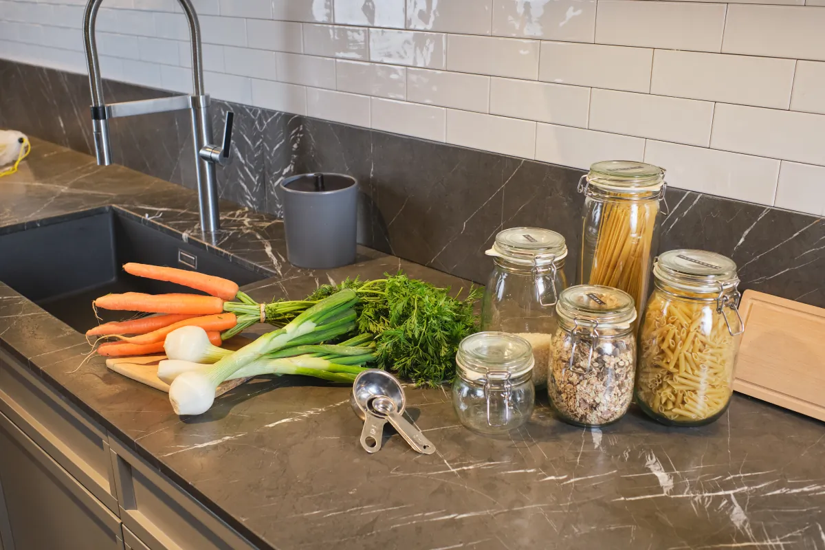 soapstone countertops noodles and vegetables on kitchen counter