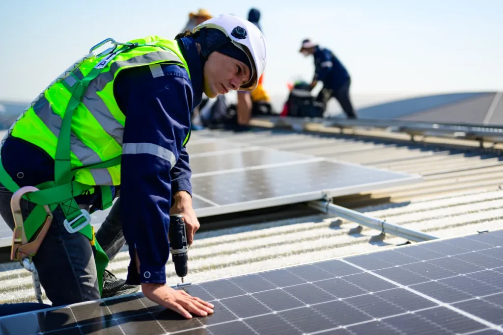 solar panel professional engineer with safety helmet checking
