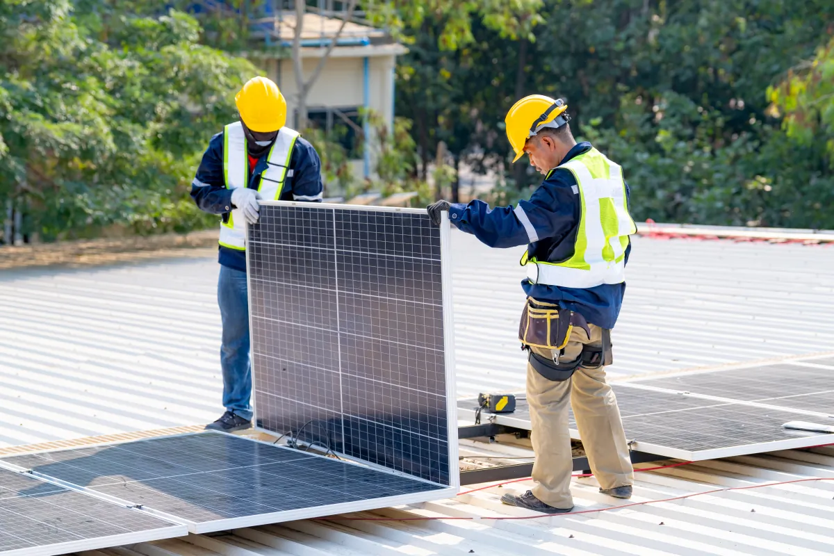 solar panel workers installing solar panels for efficient ene