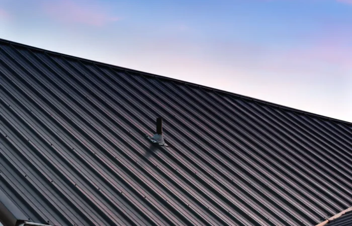 t1 siding a beautiful house metal roof during the sunset
