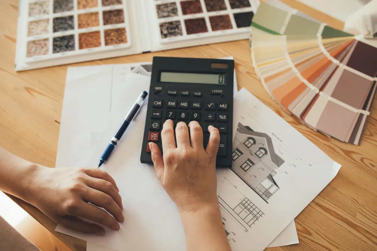 targeted discount programs woman making estimate using calculator house