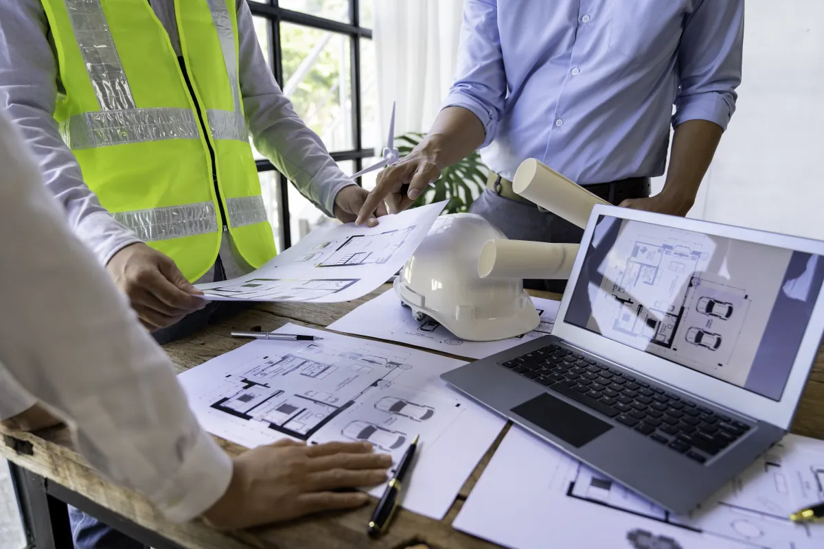 turnkey design build delivery architecture engineer teamwork meeting drawing