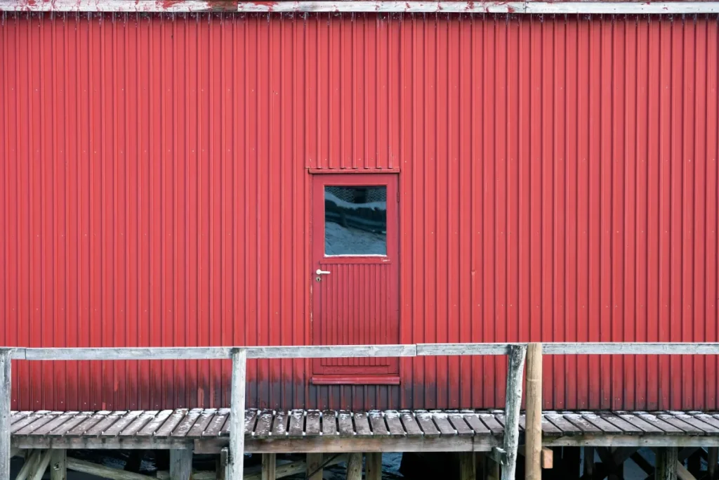 vertical siding metallic door and wall of warehouse on coastline i