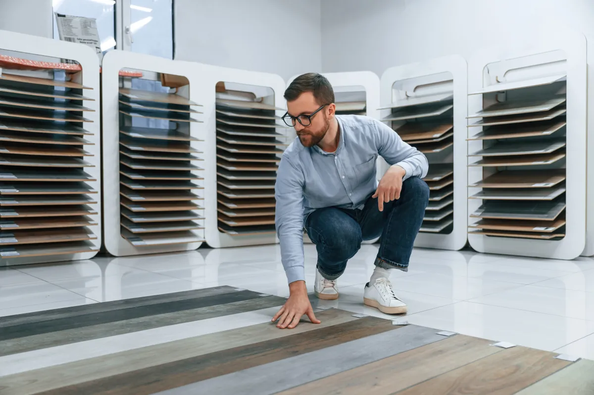 vinyl tile or laminate sitting and choosing parquet man is in the