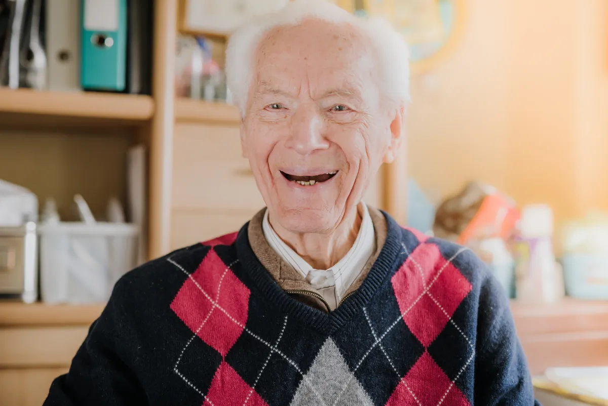 warranty post project support portrait happy senior drinking coffee