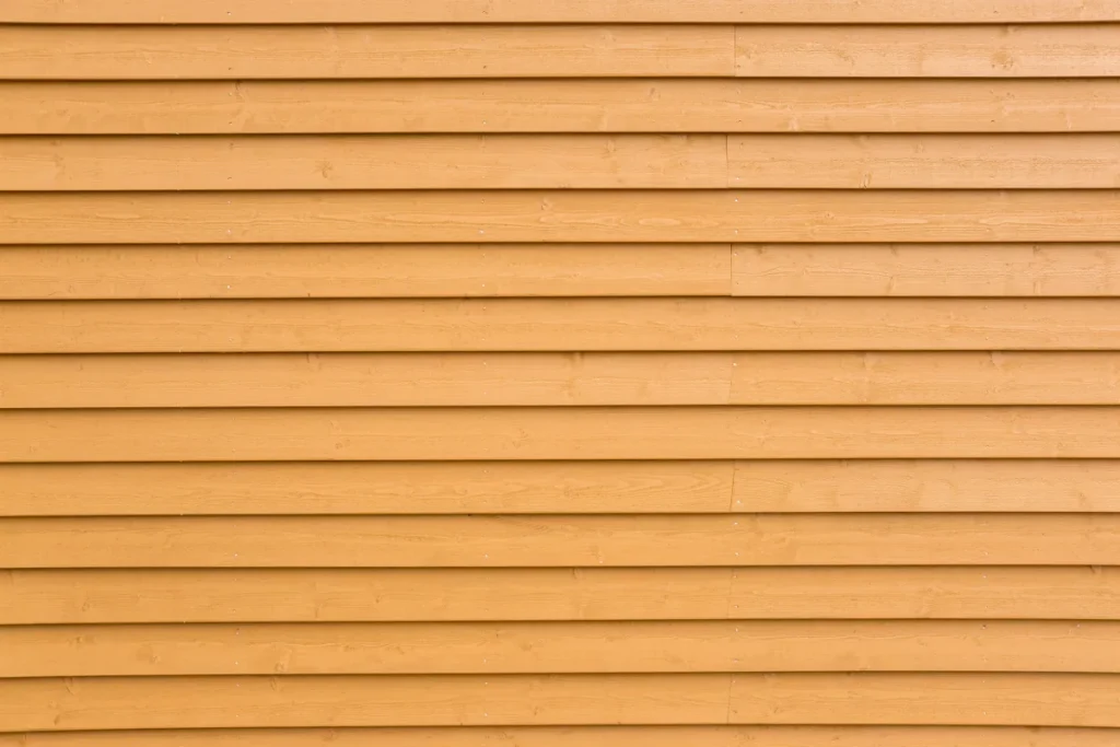 wood siding painted yellow plank wall