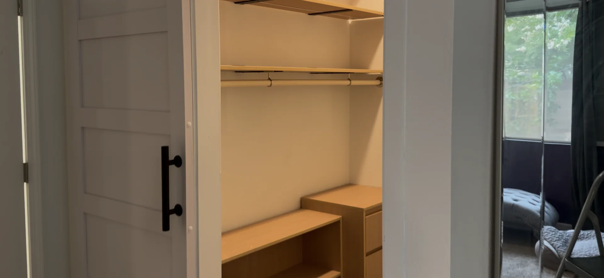 Custom closet storage system with shelving, hanging space, integrated lighting, and organized cabinetry in a Roseville remodel.