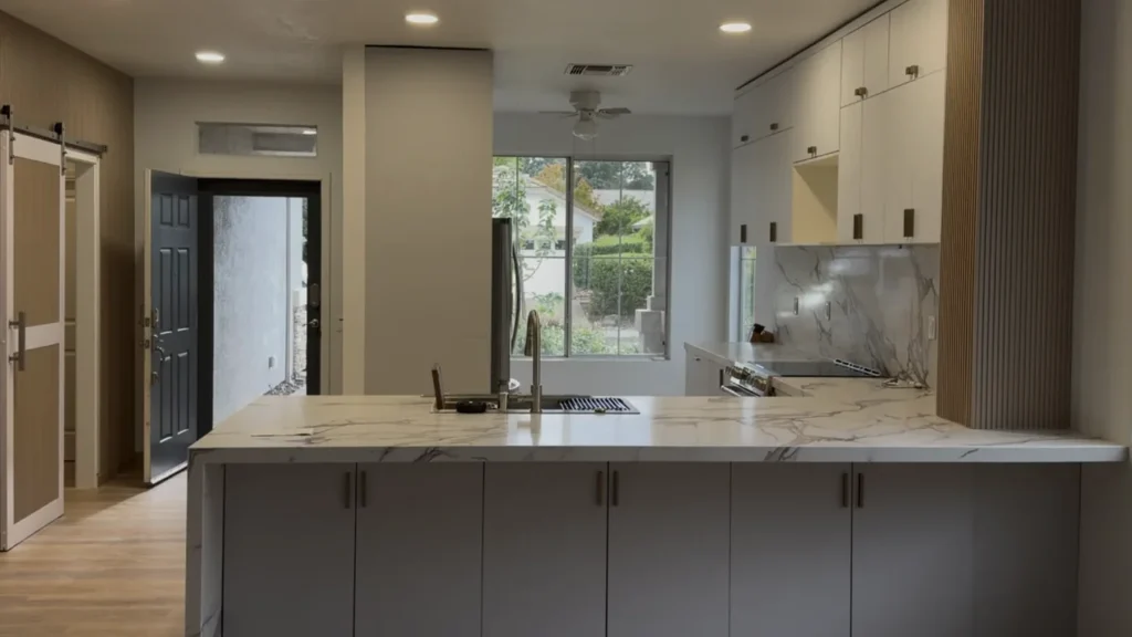 Completed kitchen aligned by the window and countertop to match the original
