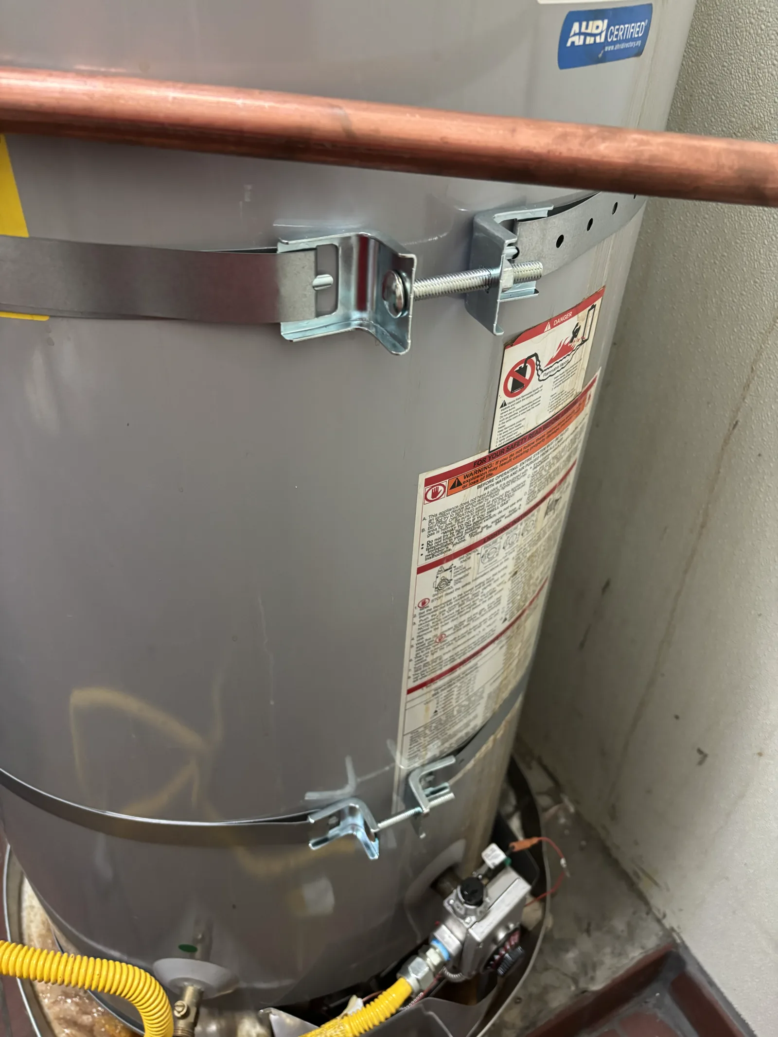 Seismic restraint straps and lower control area on the existing commercial gas water heater.