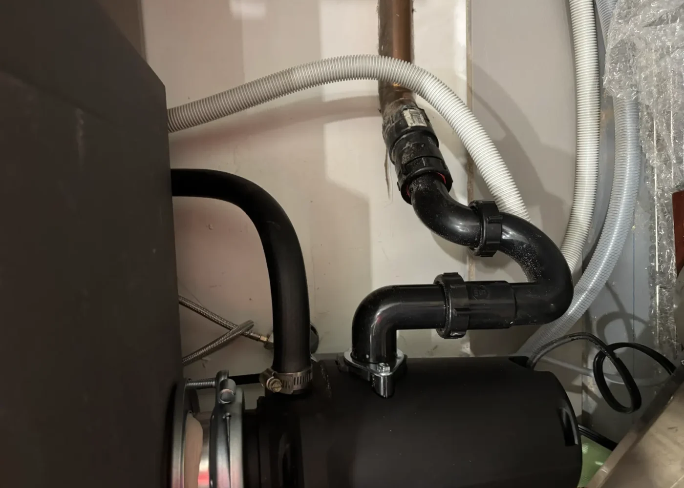 Completed garbage disposal replacement and reconnected under-sink drain piping by USC in Sacramento