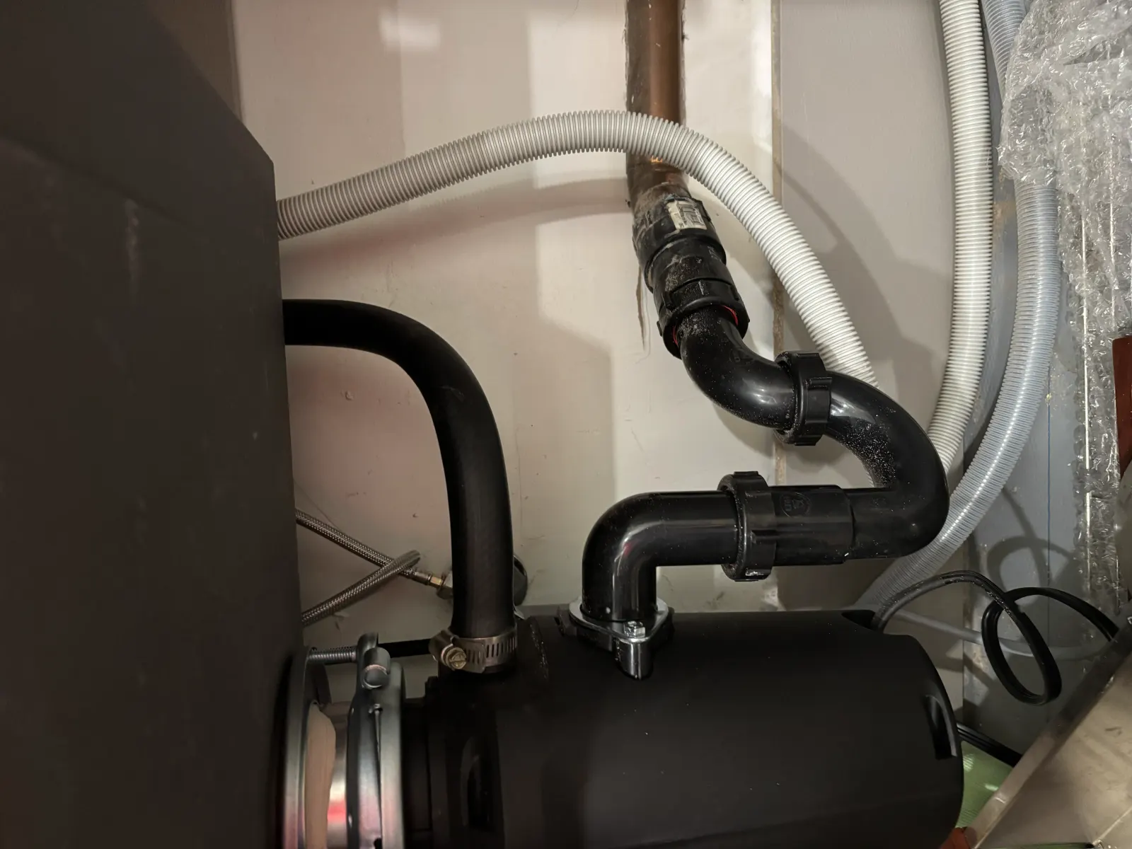 Completed garbage disposal replacement and reconnected under-sink drain piping by USC in Sacramento