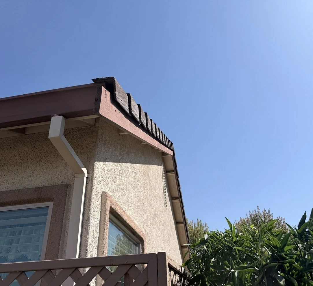 Deteriorated board along the tile roof edge before the Elk Grove roof repair