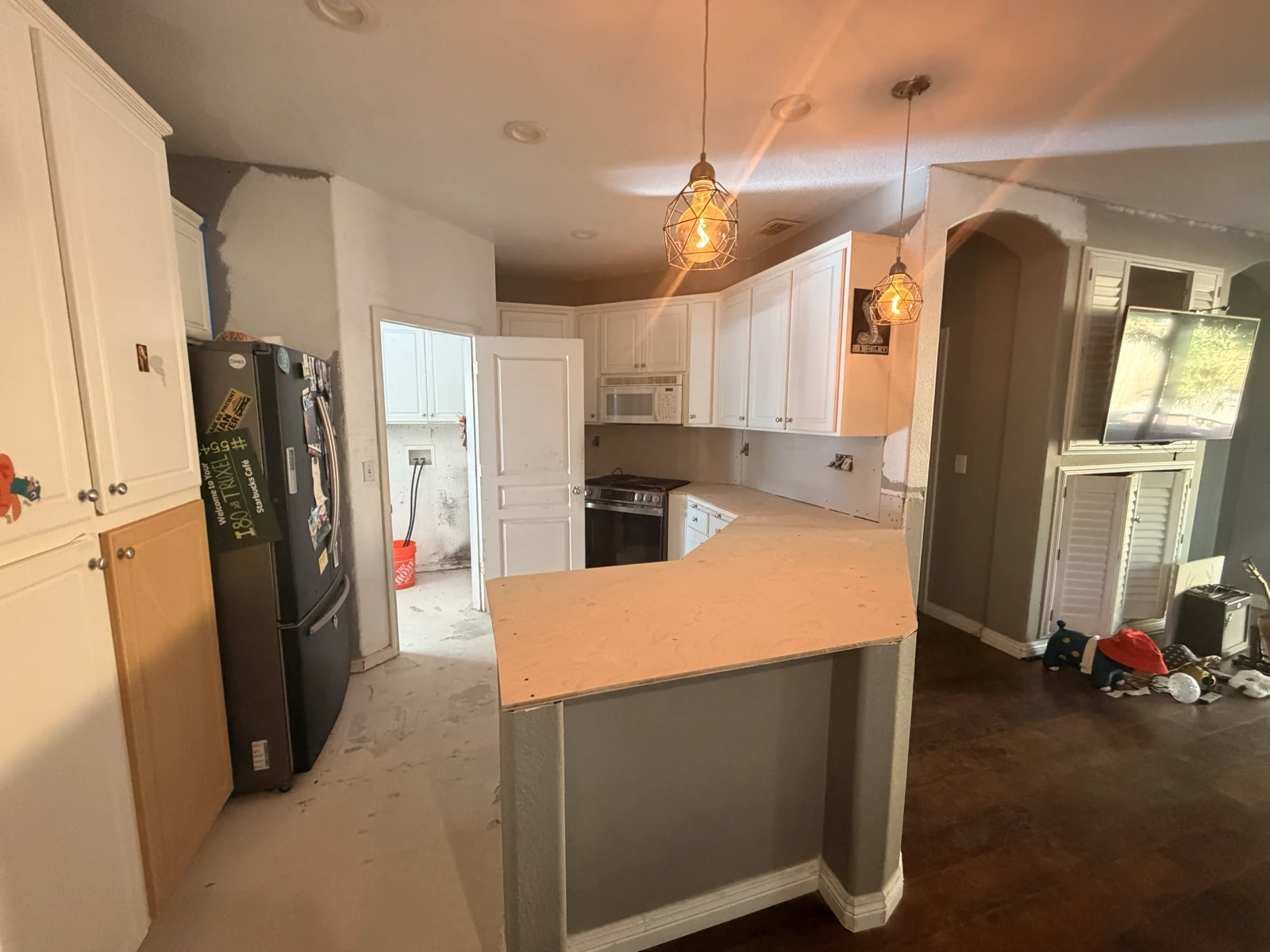 Plywood countertop base and lowered peninsula prepared for new quartz in the Sacramento kitchen
