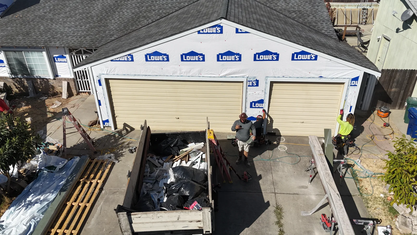 House wrap across the garage wall before siding installation in Sacramento